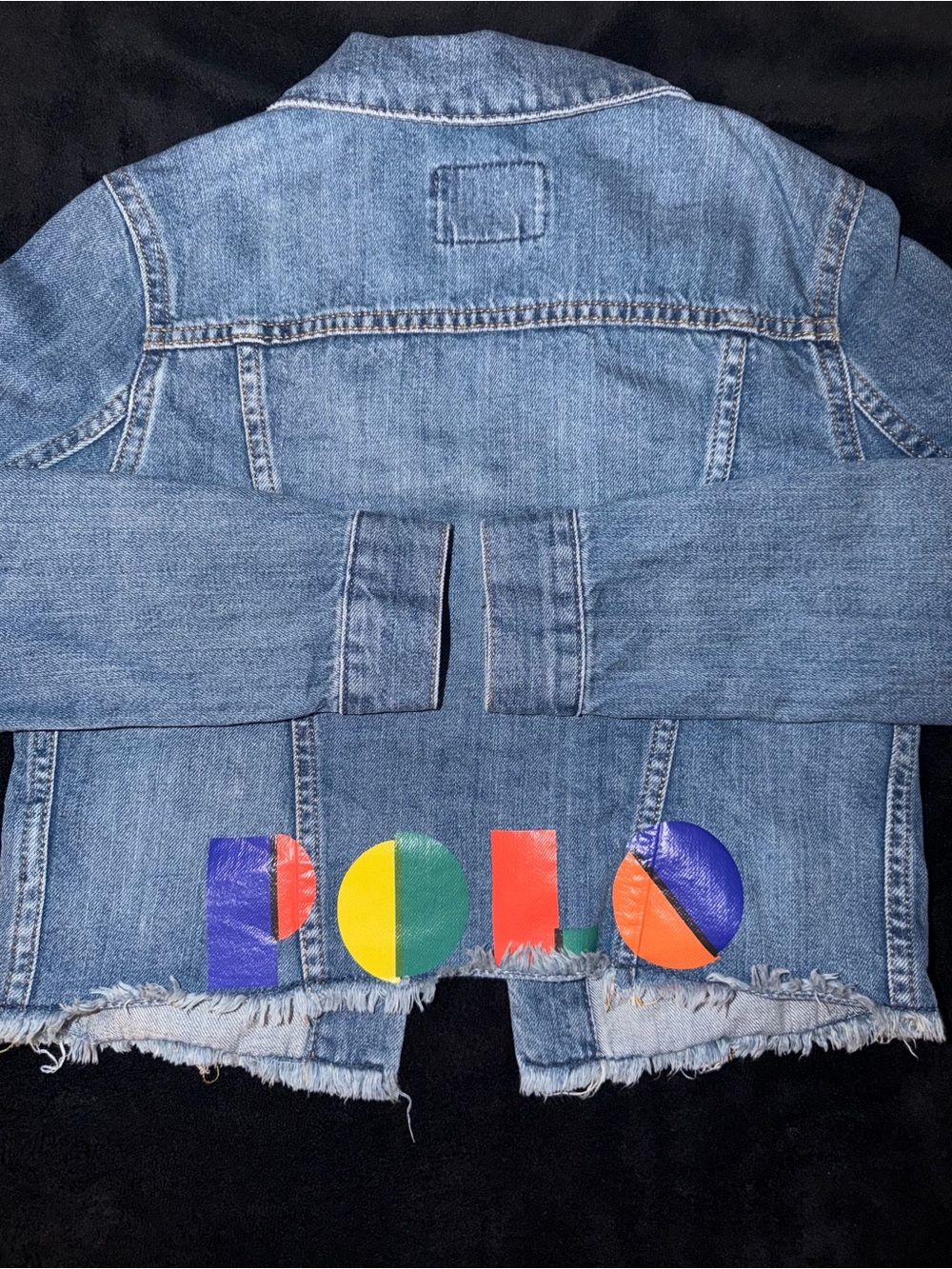 Ralph Lauren Polo Light Blue Denim distressed Jacket. Polo print on the back.